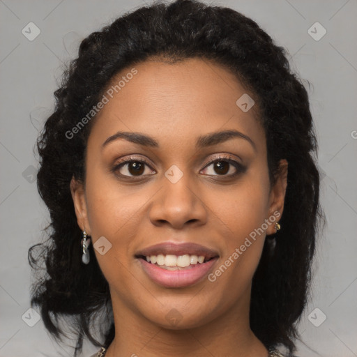 Joyful black young-adult female with long  brown hair and brown eyes