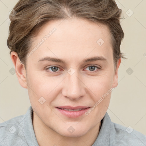 Joyful white young-adult female with short  brown hair and grey eyes