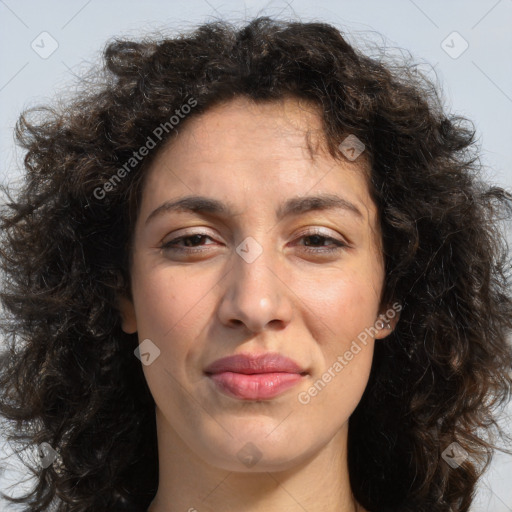 Joyful white adult female with long  brown hair and brown eyes