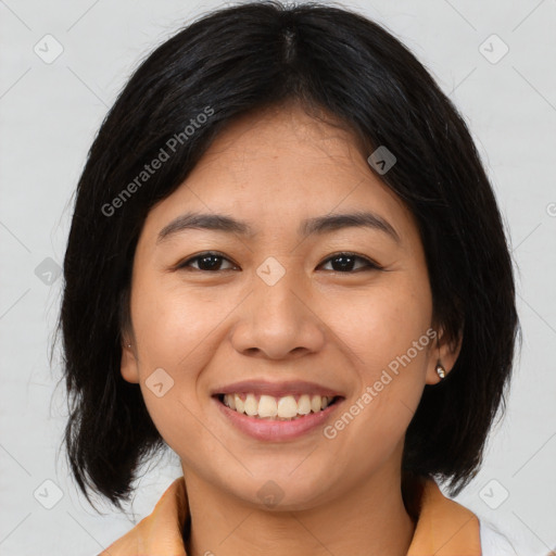 Joyful asian young-adult female with medium  brown hair and brown eyes