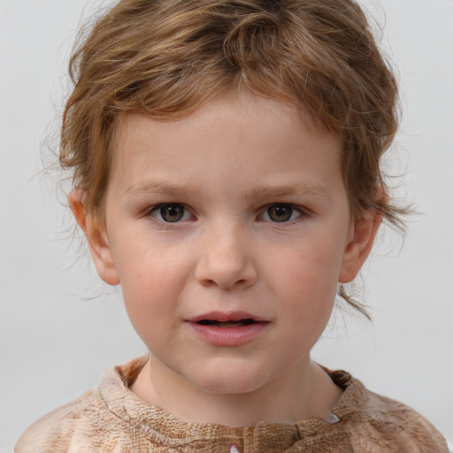 Joyful white child male with medium  brown hair and grey eyes