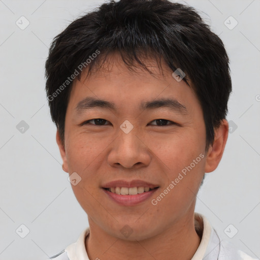 Joyful asian young-adult male with short  brown hair and brown eyes