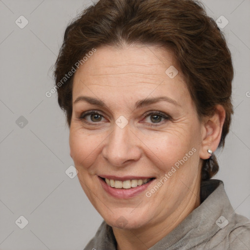 Joyful white adult female with short  brown hair and brown eyes