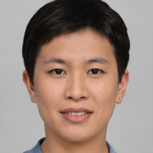 Joyful asian young-adult male with short  brown hair and brown eyes