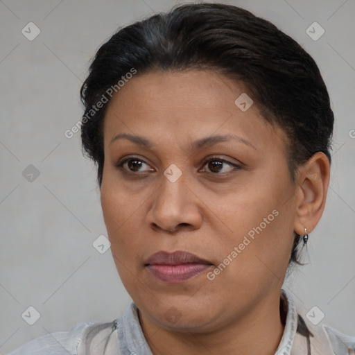 Joyful latino adult female with short  brown hair and brown eyes