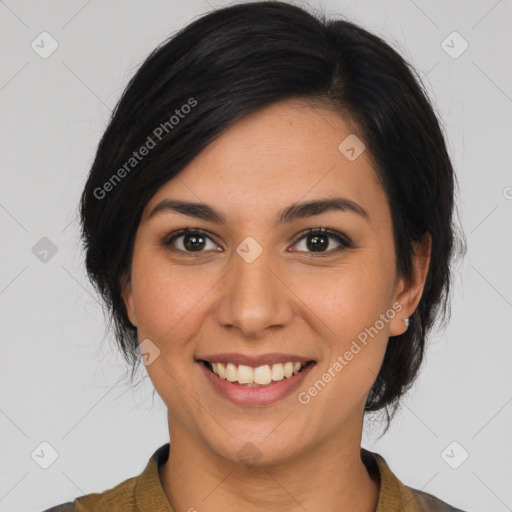 Joyful latino young-adult female with medium  brown hair and brown eyes