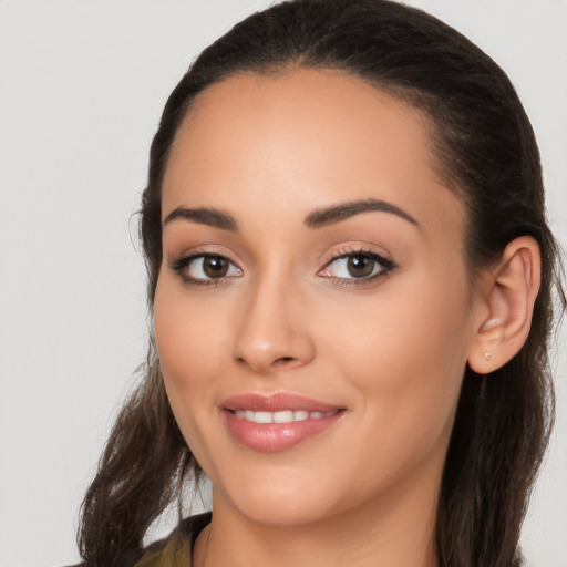 Joyful white young-adult female with long  brown hair and brown eyes