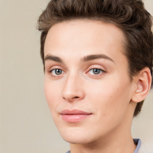 Joyful white young-adult female with short  brown hair and green eyes