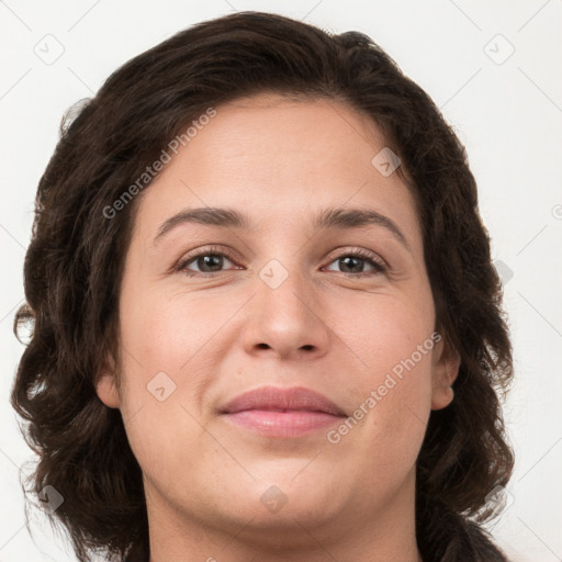 Joyful white young-adult female with medium  brown hair and green eyes