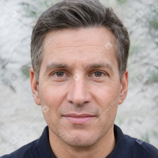 Joyful white adult male with short  brown hair and grey eyes