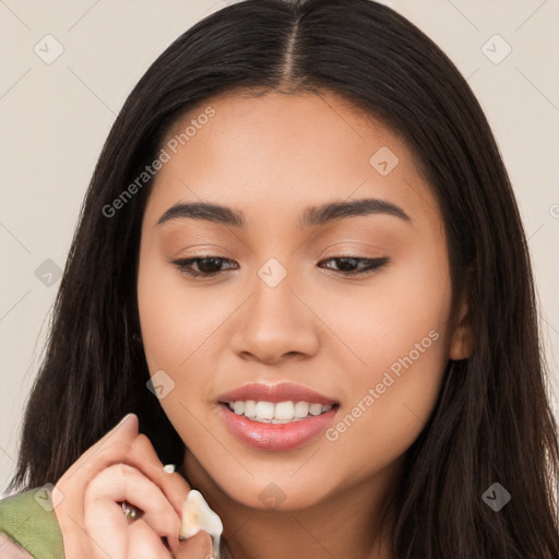 Joyful latino young-adult female with long  brown hair and brown eyes