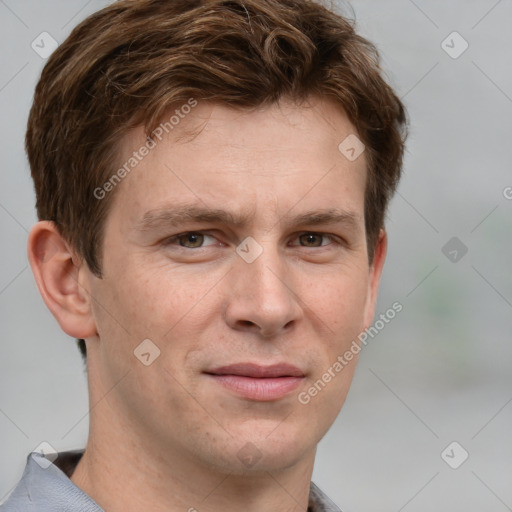 Joyful white adult male with short  brown hair and grey eyes