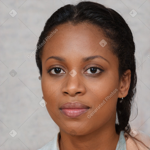 Joyful black young-adult female with medium  brown hair and brown eyes