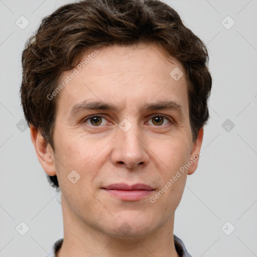 Joyful white adult male with short  brown hair and grey eyes