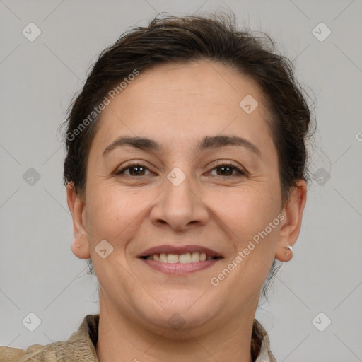 Joyful white adult female with short  brown hair and brown eyes