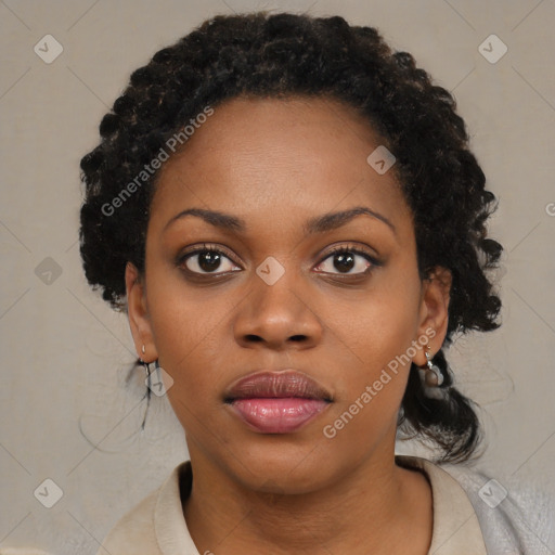 Joyful black young-adult female with medium  black hair and brown eyes