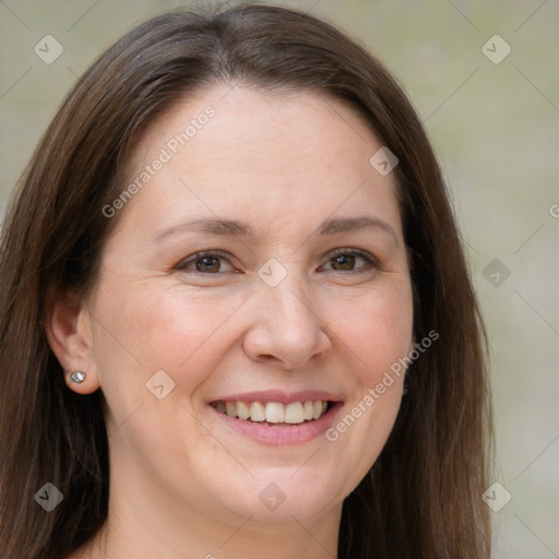 Joyful white adult female with long  brown hair and grey eyes