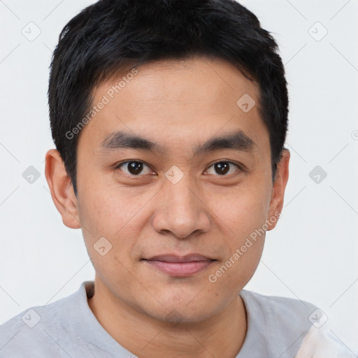 Joyful white young-adult male with short  black hair and brown eyes