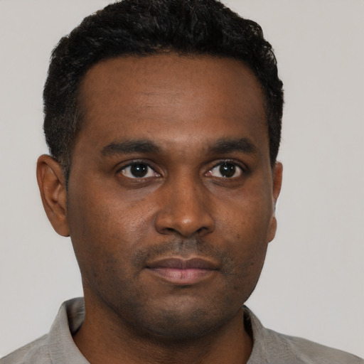 Neutral black young-adult male with short  black hair and brown eyes
