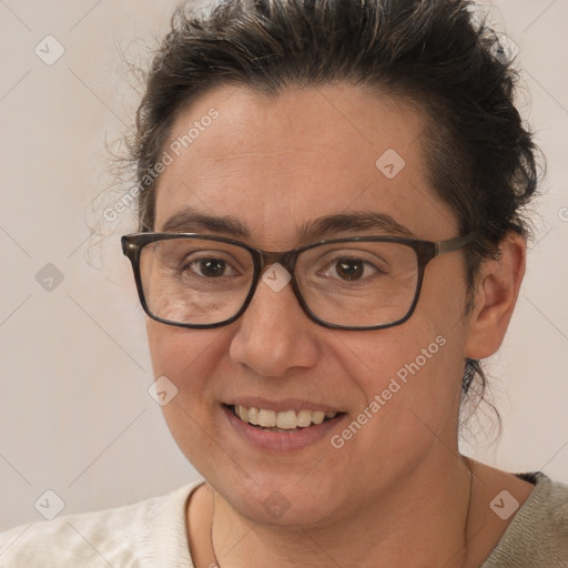 Joyful white adult female with short  brown hair and brown eyes