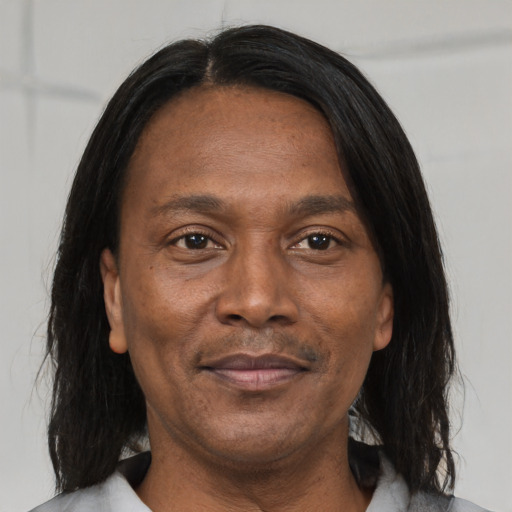 Joyful asian adult male with medium  brown hair and brown eyes