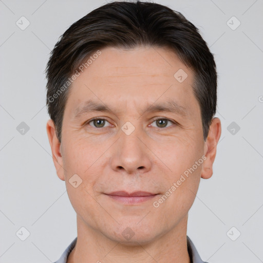 Joyful white adult male with short  brown hair and brown eyes