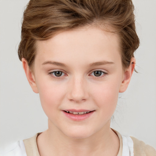 Joyful white child female with short  brown hair and grey eyes