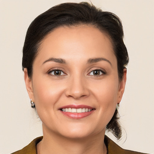 Joyful white young-adult female with medium  brown hair and brown eyes