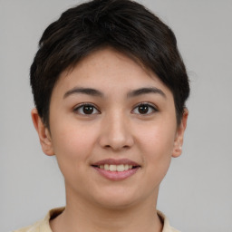 Joyful asian young-adult female with short  brown hair and brown eyes