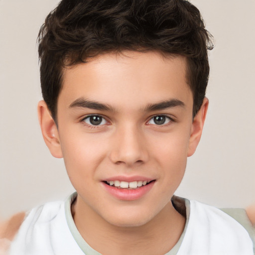 Joyful white child male with short  brown hair and brown eyes