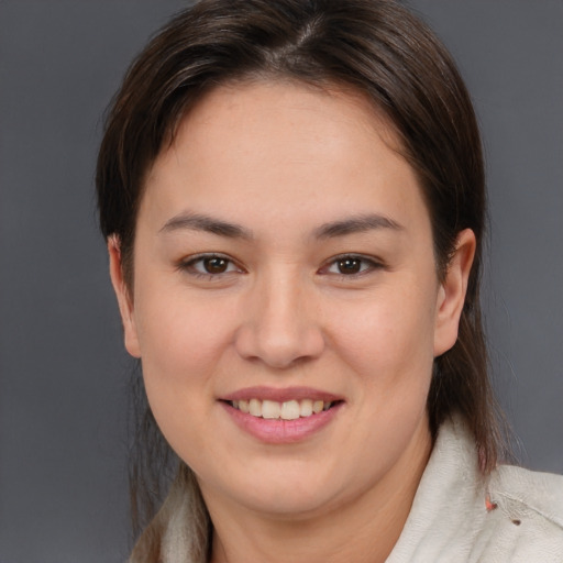 Joyful white young-adult female with medium  brown hair and brown eyes