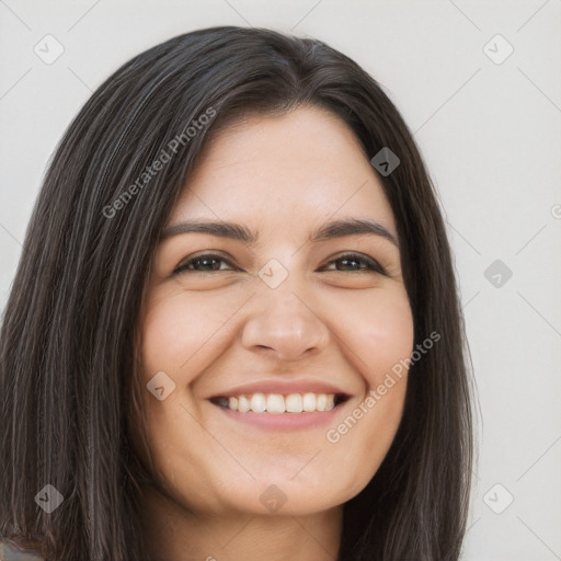 Joyful white young-adult female with long  brown hair and brown eyes