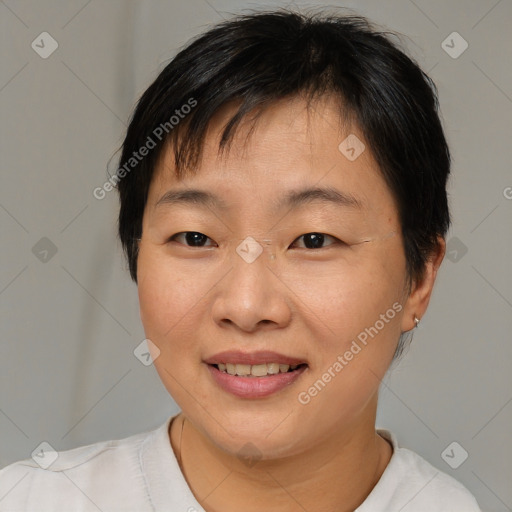 Joyful asian young-adult female with short  brown hair and brown eyes