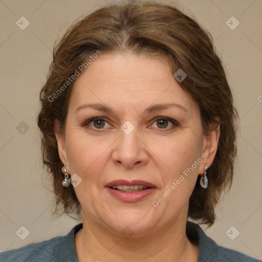 Joyful white adult female with medium  brown hair and grey eyes