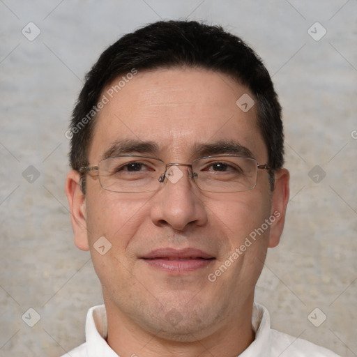 Joyful white adult male with short  black hair and brown eyes