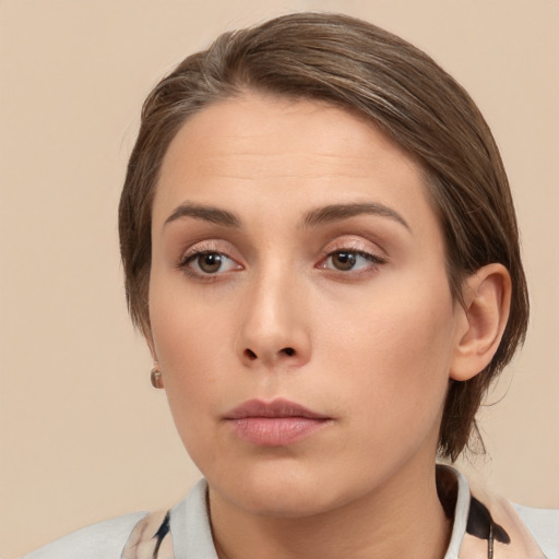 Neutral white young-adult female with medium  brown hair and brown eyes