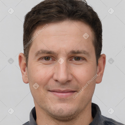 Joyful white adult male with short  brown hair and grey eyes