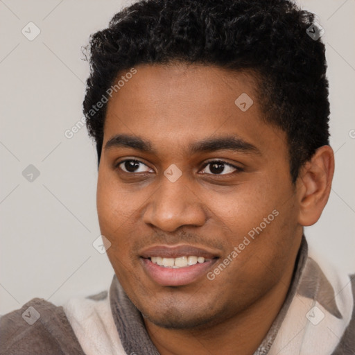 Joyful black young-adult male with short  black hair and brown eyes