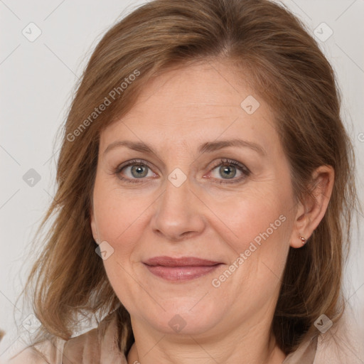 Joyful white adult female with medium  brown hair and brown eyes