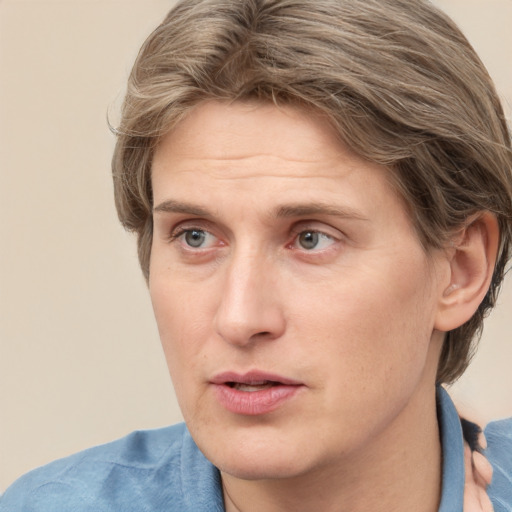 Joyful white adult male with short  brown hair and grey eyes