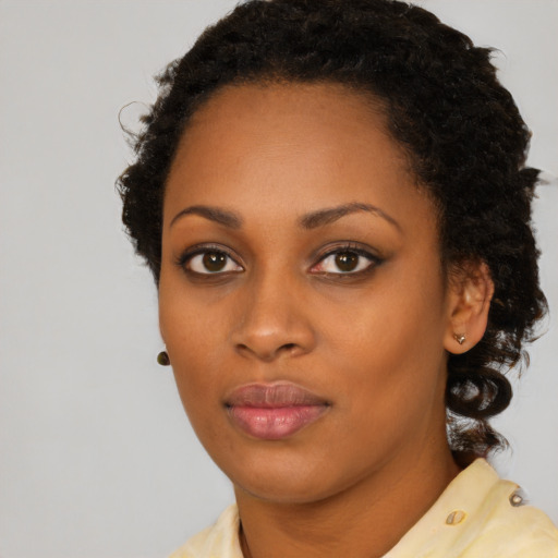 Neutral black young-adult female with medium  black hair and brown eyes