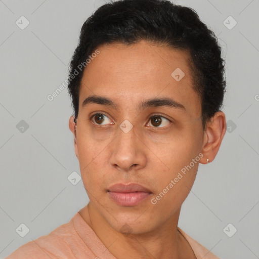 Neutral latino young-adult male with short  black hair and brown eyes