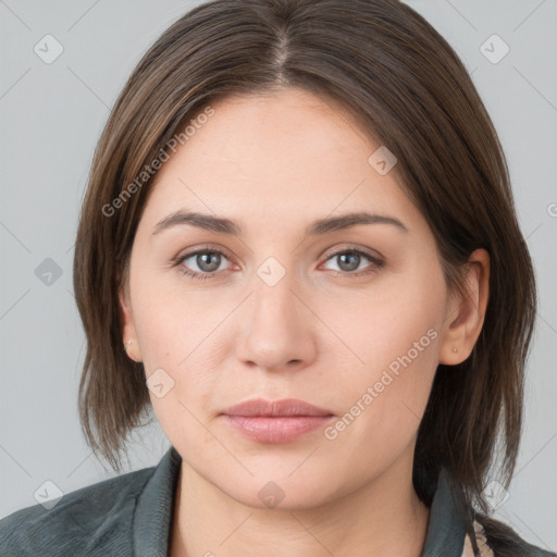 Neutral white young-adult female with medium  brown hair and grey eyes