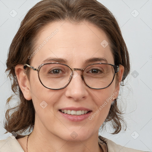 Joyful white adult female with medium  brown hair and grey eyes