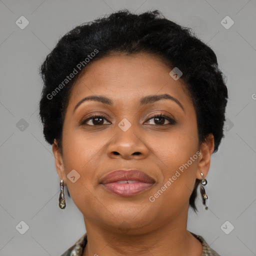 Joyful latino adult female with short  brown hair and brown eyes