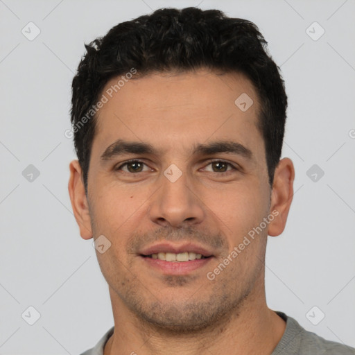 Joyful white young-adult male with short  black hair and brown eyes
