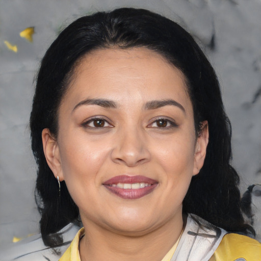 Joyful asian adult female with medium  brown hair and brown eyes
