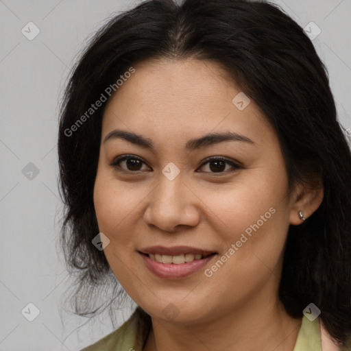 Joyful latino young-adult female with long  brown hair and brown eyes