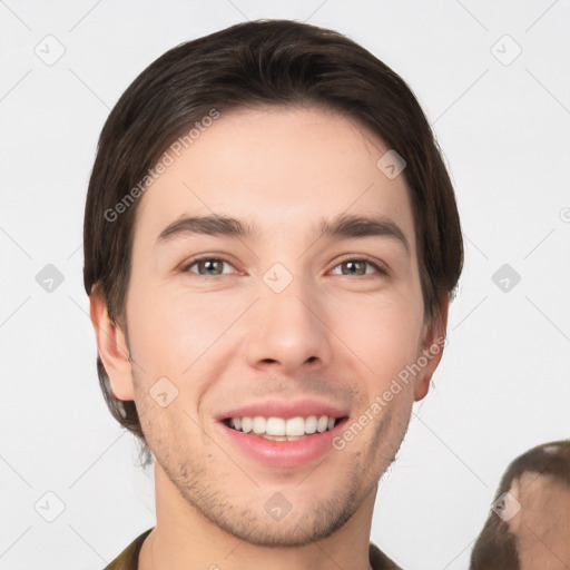 Joyful white young-adult male with short  brown hair and brown eyes