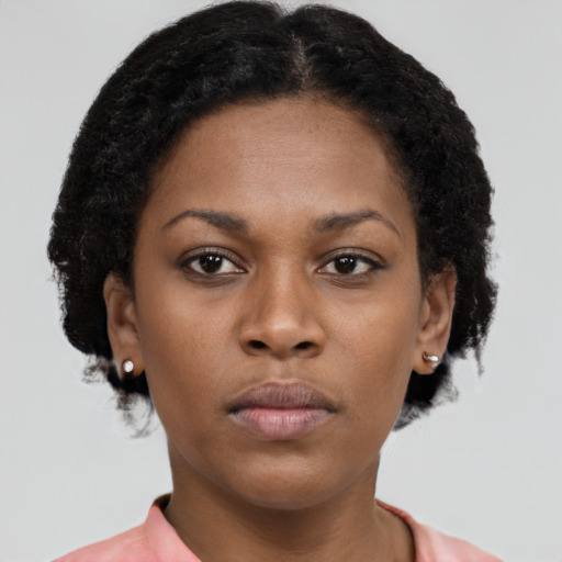 Neutral latino young-adult female with short  brown hair and brown eyes